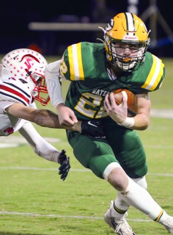 Senior Hunter Johnson made a strong run to score Gatewood’s first touchdown, diving across the goal line with two EBA defenders in tow. IAN TOCHER/Staff