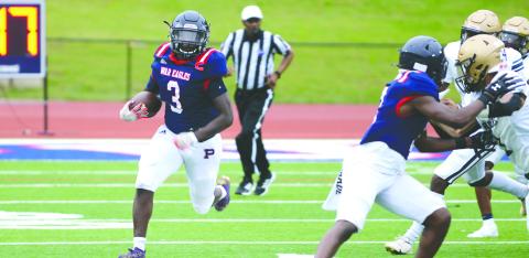 Daniel (3) runs away from Jefferson County defenders toward the sideline in a scrimmage last May. IAN TOCHER/Staff