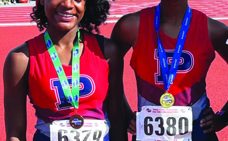 Faith Watkins (left) and Aubree Butts (right) were the only Putnam County girls track and field athletes to qualify for the GHSA Class A Division I state meet. CONTRIBUTED