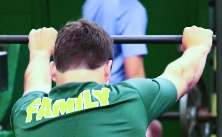 Gatewood coaches want their players to be like “family” to each other, committed to helping whether in the gym or on the football field. TREY NORRIS/Staff