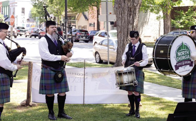 Bagpipers and drummers play outside as attendees arrive to First Presbyterian Church in Greensboro for Scottish Heritage Day. LEIGH LOFGREN/Staff