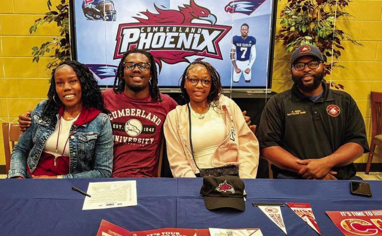 Putnam County’s RJ Hines (second from left) recently signed to continue his football career at Cumberland University. CONTRIBUTED