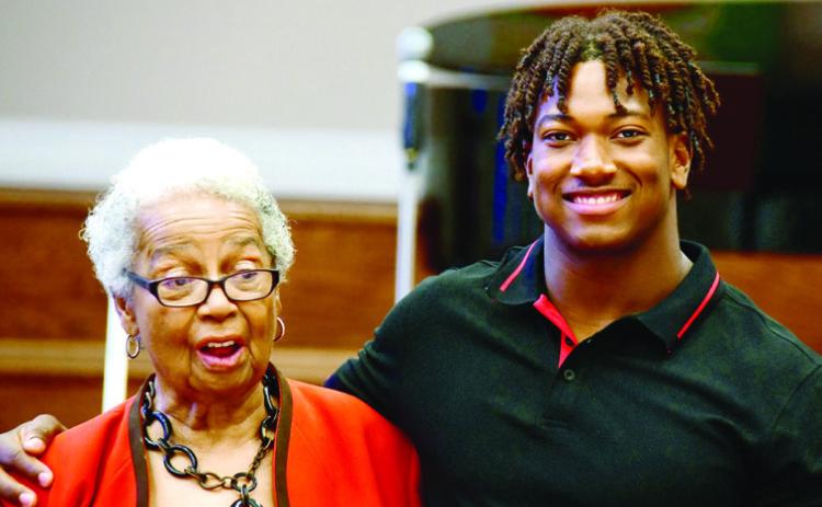 Georgia Benjamin-Smith called recent Putnam High grad Amario up from the audience to share a little of his story as he prepares for college life. IAN TOCHER/Staff
